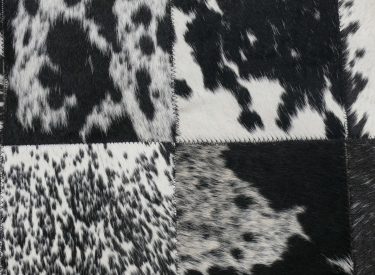(b) Medium black & white Nguni quilt carpet close-up.