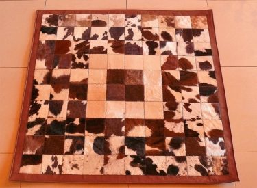 (a) Small tri-colour Nguni hide quilt carpet.
