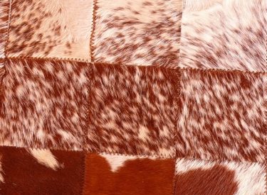 (b) Small brown & white Nguni hide quilt carpet - close-up
