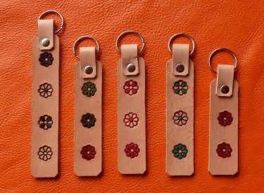Embossed daisy, hand dyed on natural leather keyrings (from R50)