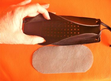 Mask perforated grid for breathing and audio.